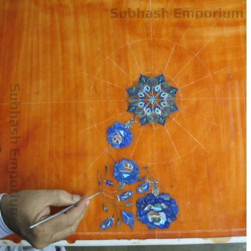 Inlay stones being set into marble