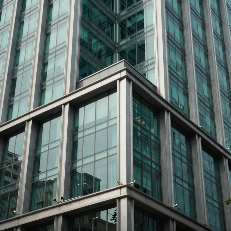 A modern architectural detail of a financial institution in a South Asian / Indian city, featuring steel teal and glass.