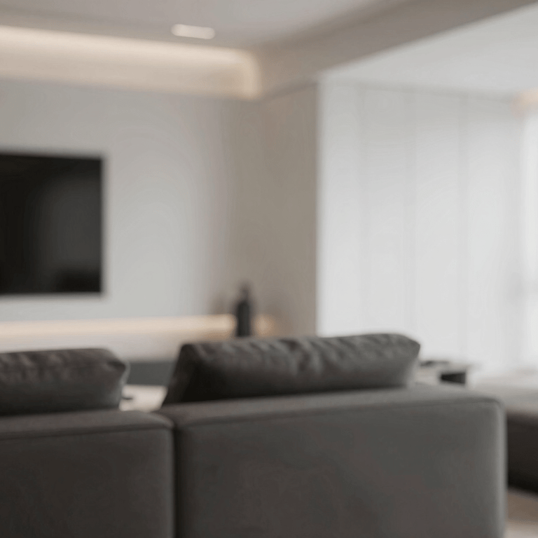 A close-up of premium marble countertops and soft off-white cabinetry in a luxury kitchen remodel.