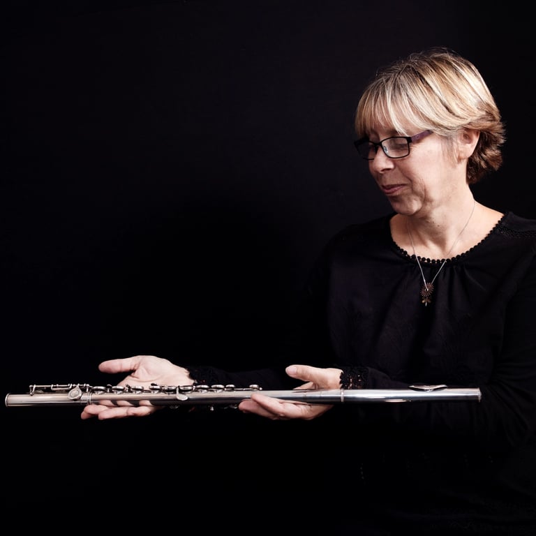 Woman with flute in the dark
