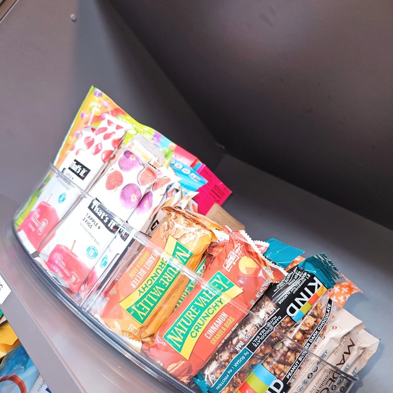 Lazy Susan filled with snack that are arranged and organized by color.