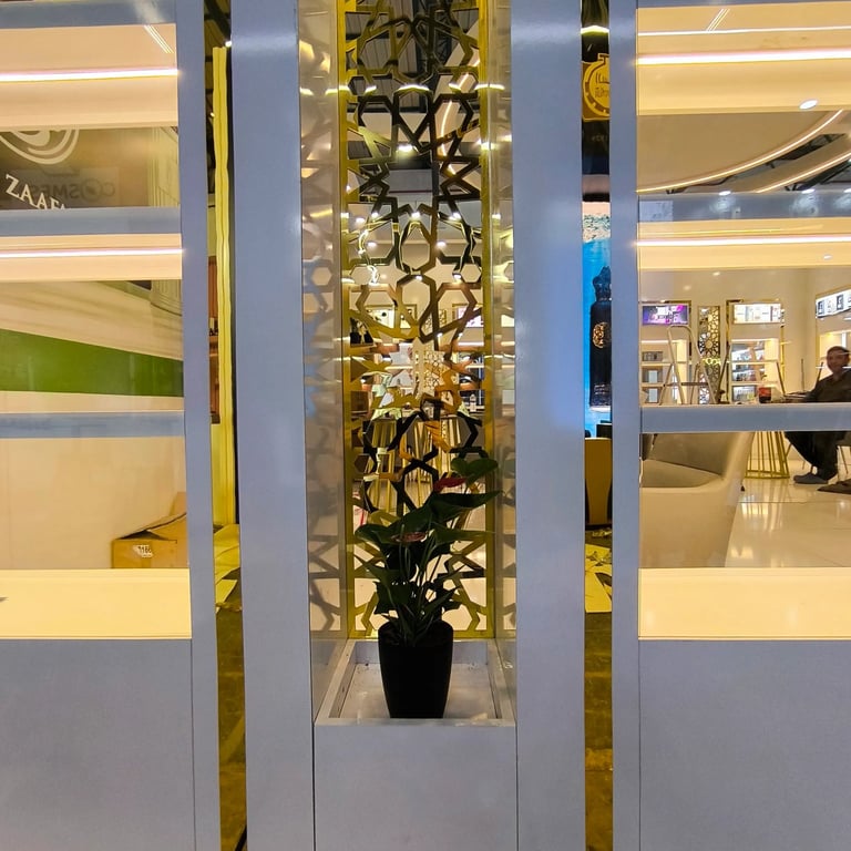 Bespoke gold geometric patterns and eco-friendly plant detail on a premium Ard Al Zaafaran exhibit by World Expo Pro.