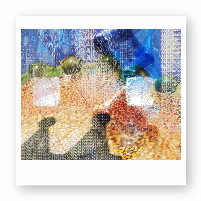 Abstract colorful glass mosaic art with vibrant blue, gold, and orange tiled patterns.