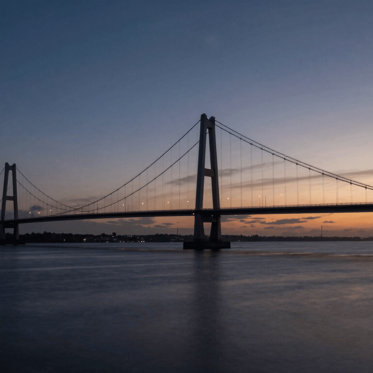 A sleek dark navy car driving through a suburban British / UK neighborhood during the day.
