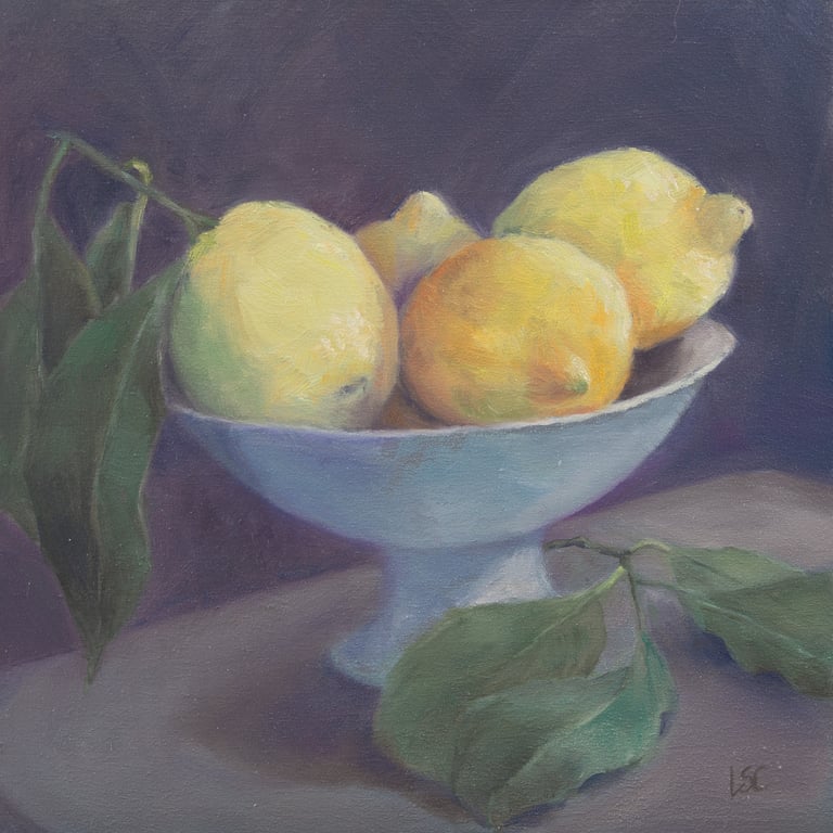 An original oil painting of fresh lemons with leaves attached in a bowl