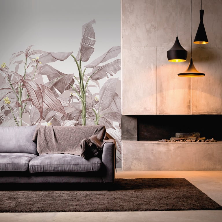 Modern living room featuring tropical leaf wallpaper, a gray sofa, and a concrete fireplace with pendant lights.