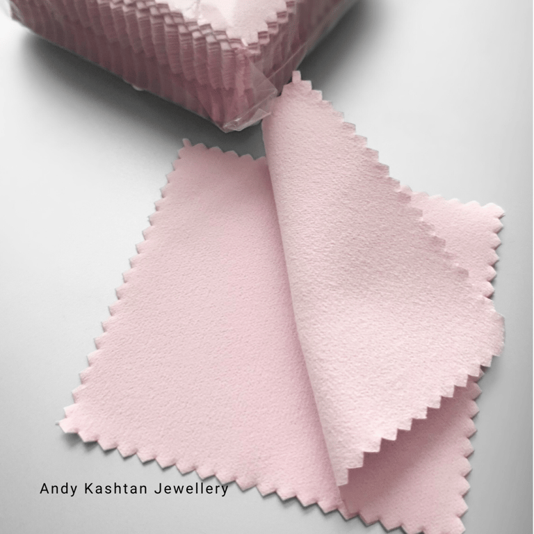 a pink and white cloth with a pink ribbon