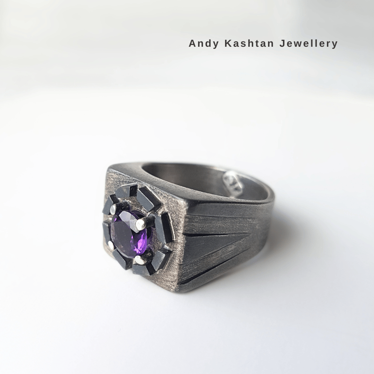 Handcrafted men's sterling silver signet ring featuring a purple amethyst gemstone and black accents.