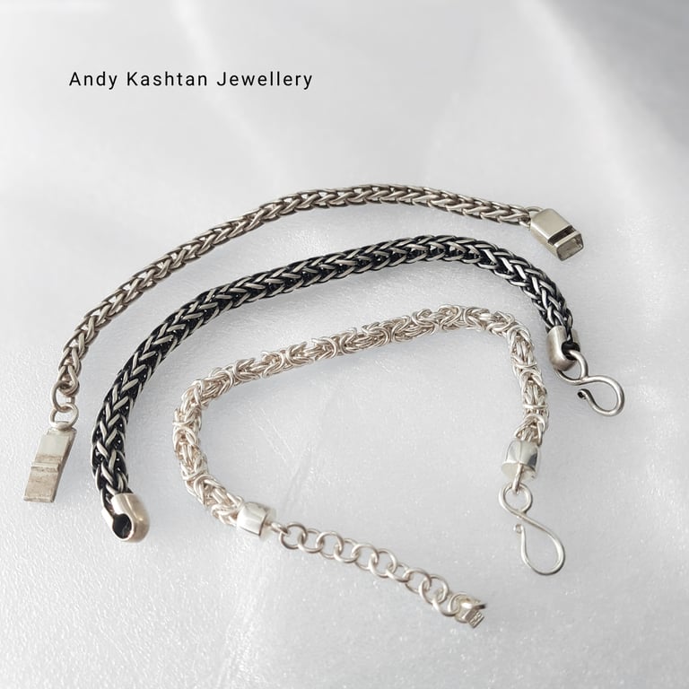 Three handcrafted sterling silver woven chain bracelets by Andy Kashtan Jewellery displayed on a white surface.