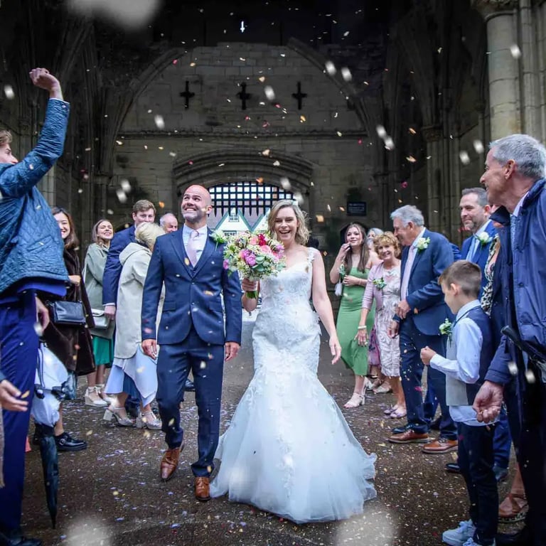 bride and groom having their confetti moment