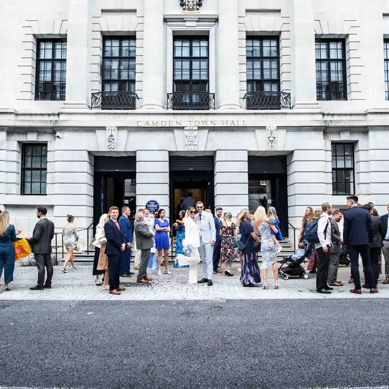 wedding party standing outside Camden Town Hall