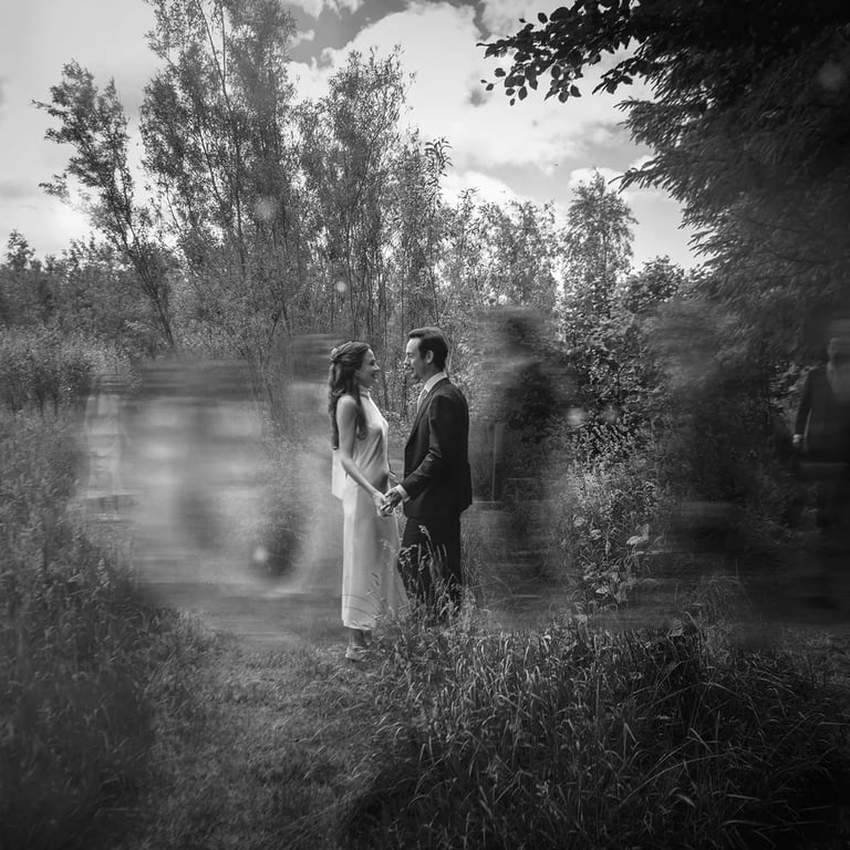 bridge and groom walking toward each other in the countryside