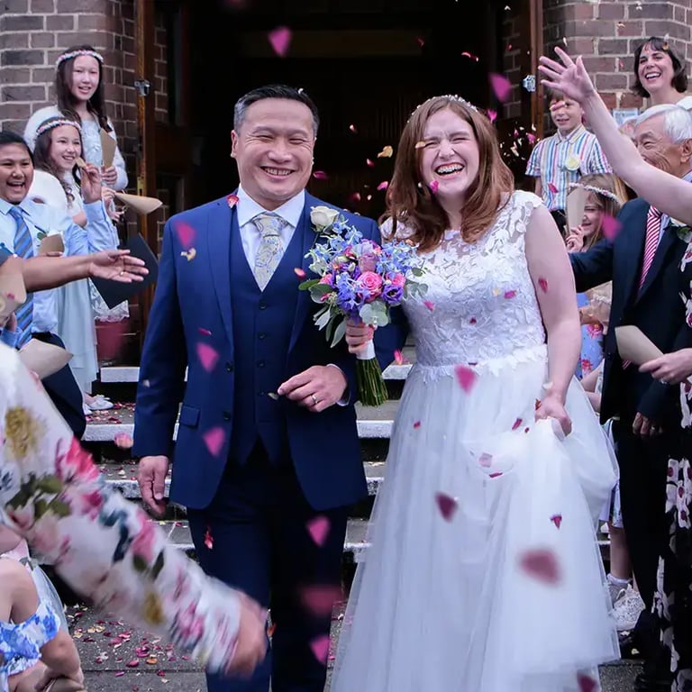 bride and groom having their confetti moment
