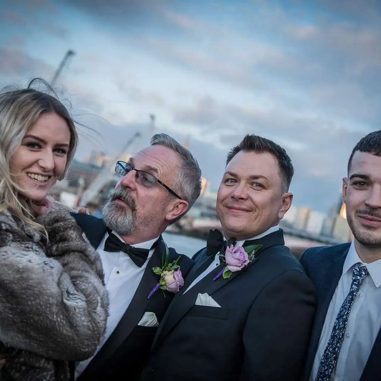 wedding party with a city skyline backdrop