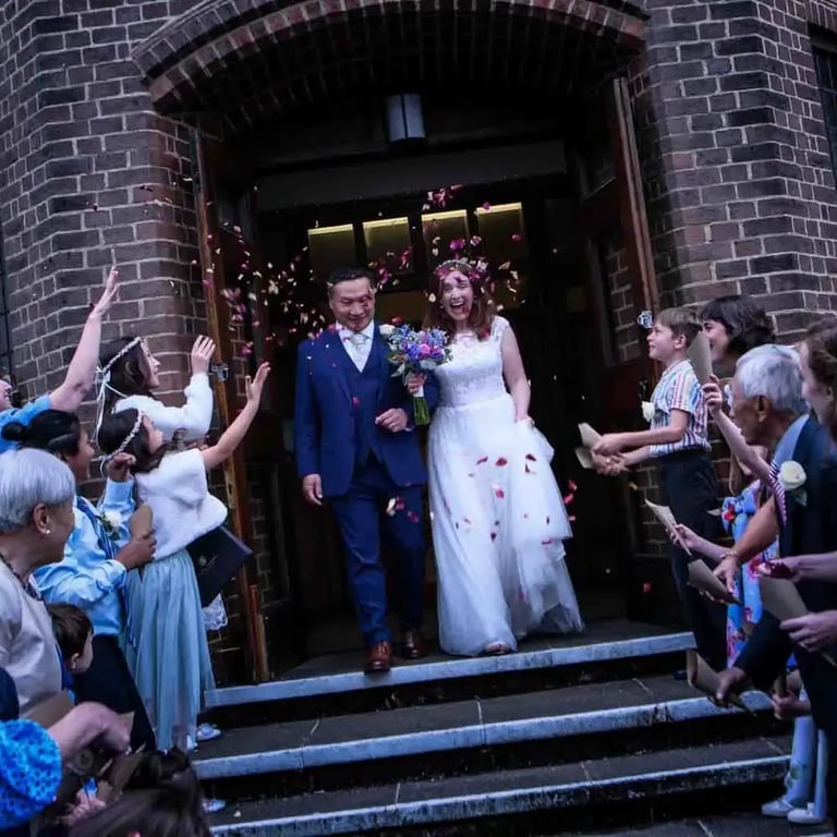 wedding couple leaving the church