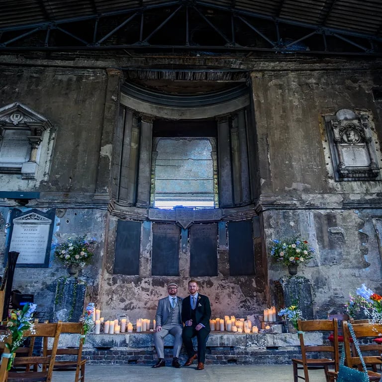 two grooms sitting inside the chapel