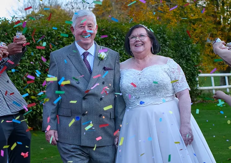 wedding couple in their confetti moment