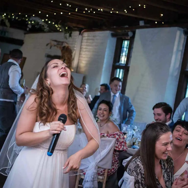bride laughing during the speeches