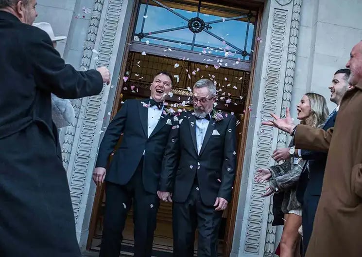 confetti being thrown for wedding couple
