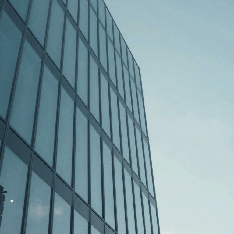 A close-up of a modern workstation with clean code visible on a sleek monitor, accented with teal #3A8D9B lighting.