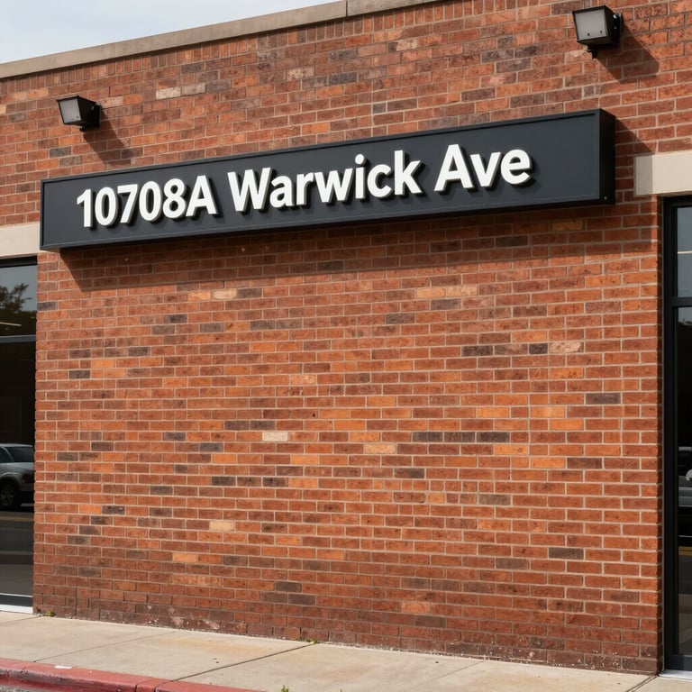 Eye-level daylight shot of the clean brick storefront at 10708A Warwick Ave, with professional signage clearly visible