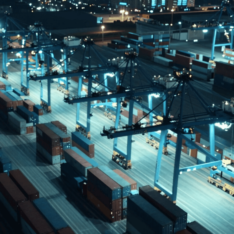 A fleet of modern, aerodynamic white delivery drones flying over a city, with #56A8C7 sky backgrounds, conveying future-proof technology.