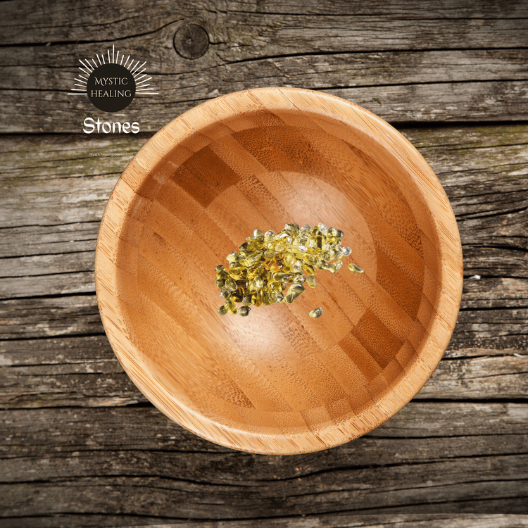Small yellow citrine healing crystals in a bamboo wooden bowl on a rustic timber background.