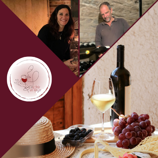 A photo of two people with La Vie en Rouge logo and a bottle of wine with grapes on a table