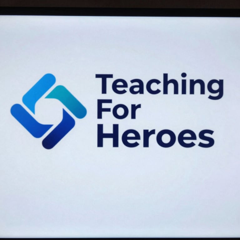 The Teaching For Heroes logo displayed on a digital screen during a technology conference, clean #F2F5F8 background.