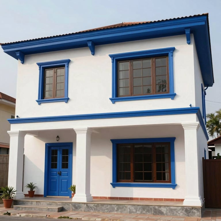A freshly painted exterior of a modern Indian villa using durable mist white and royal blue weather-resistant paints.