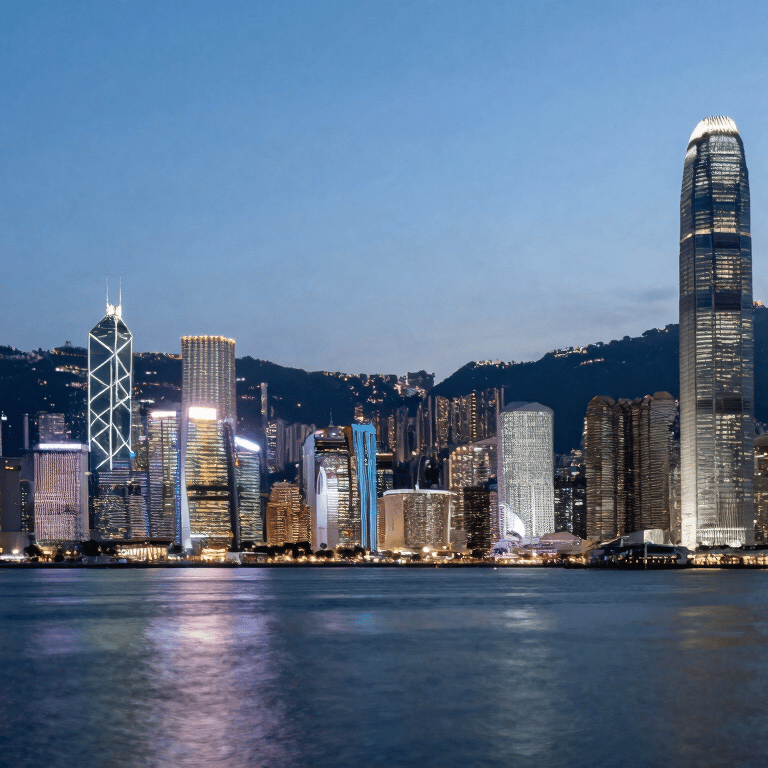 Close-up of hands typing on a modern keyboard in an East Asian / Hong Kong office, soft blue light.
