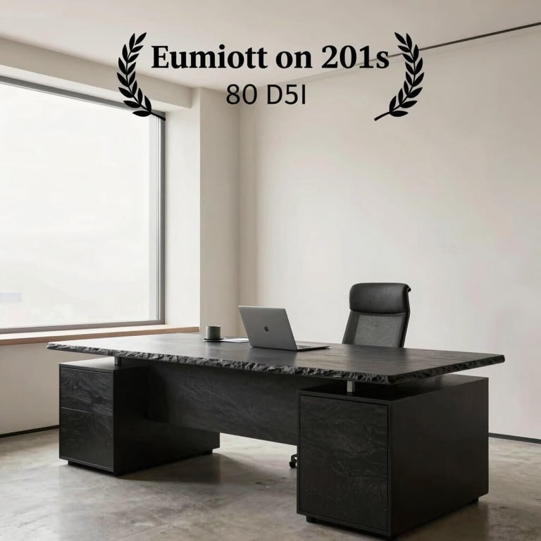 A bright, airy modern office with off-white walls and dark slate furniture accents.