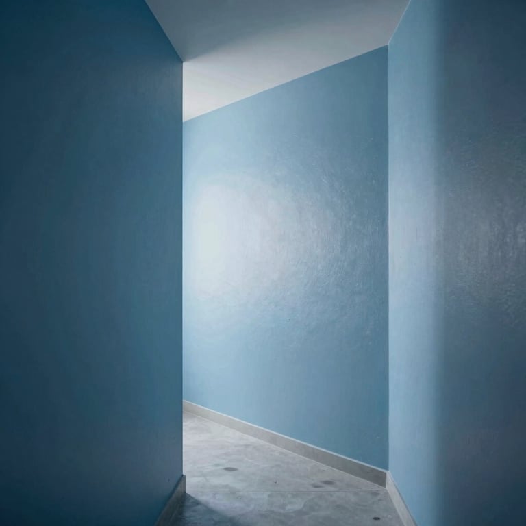 Minimalist hallway showing smooth Pladur walls and high-quality paint finish in a steel blue tone.