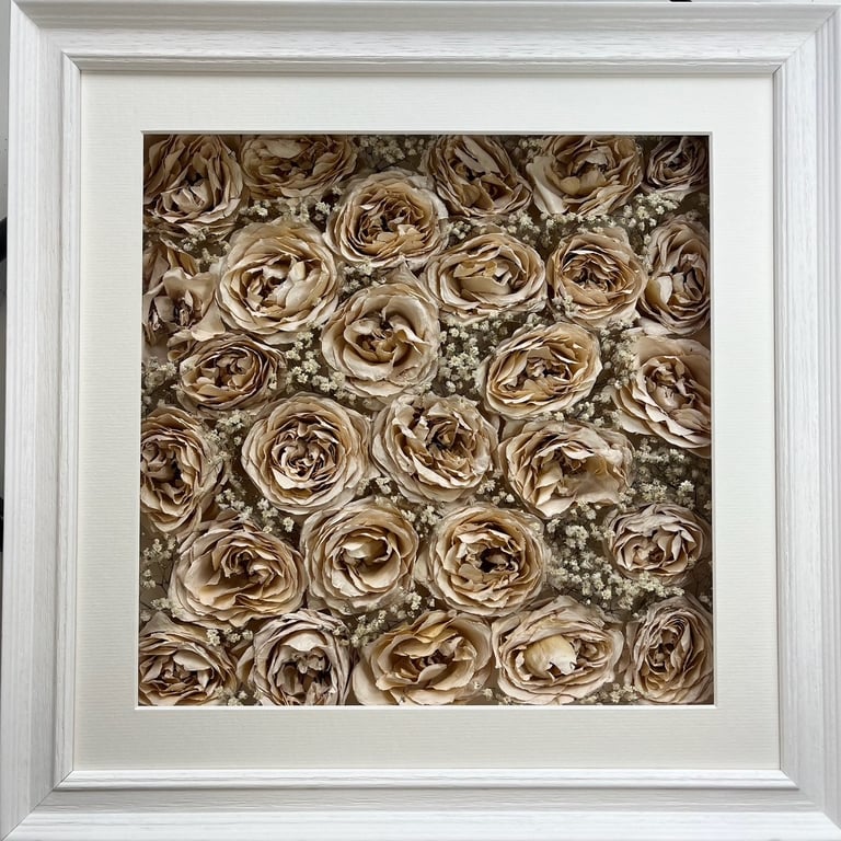 a photo of a flower wall style preserved wedding bouquet in a frame