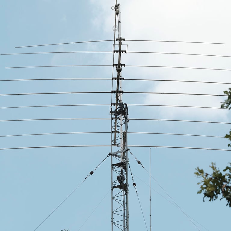 My amateur radio NA4M tower with antennas against the sky, used for receiving and transmitting signals around the world