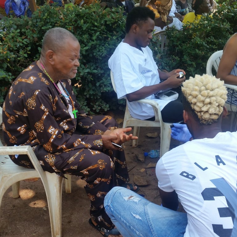 Healthcare volunteer speaking with community member during medical outreach