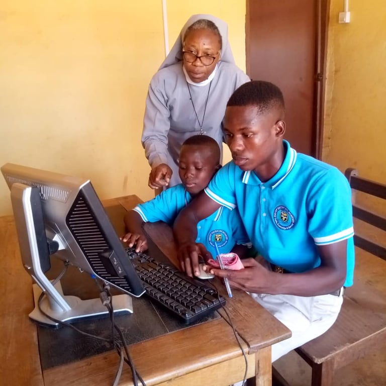 Missionary sister teaching computer skills to students