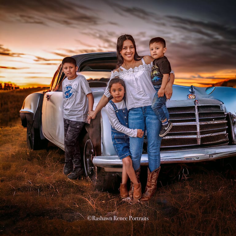 a family posing for a photo in front of a old vintage car