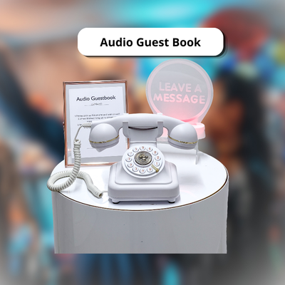 Vintage white audio guest book rotary phone with a Leave a Message neon sign for wedding events.