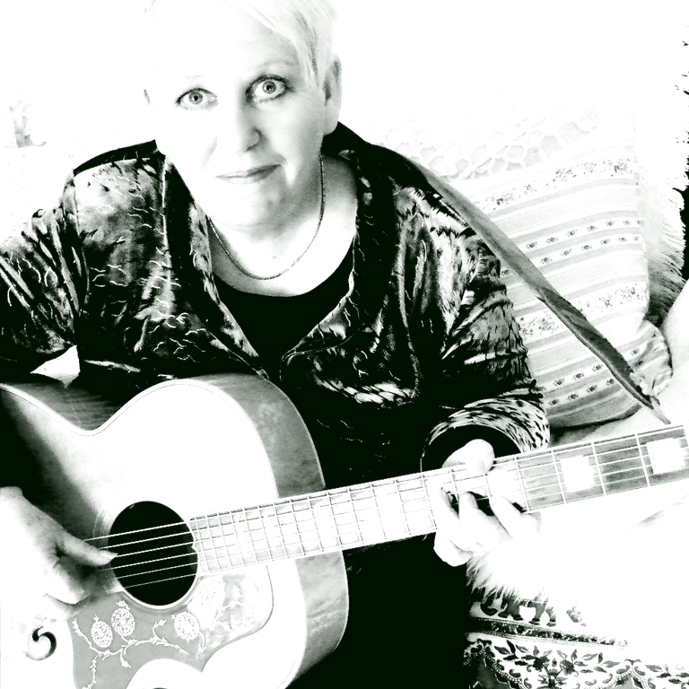 kath reade with a guitar and a guitar