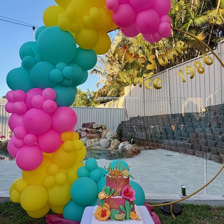 Circle Hoop backdrop with tropical balloons at a 40th Birthday in Redlandbay, Redlands - party hire by SweetAz Co.