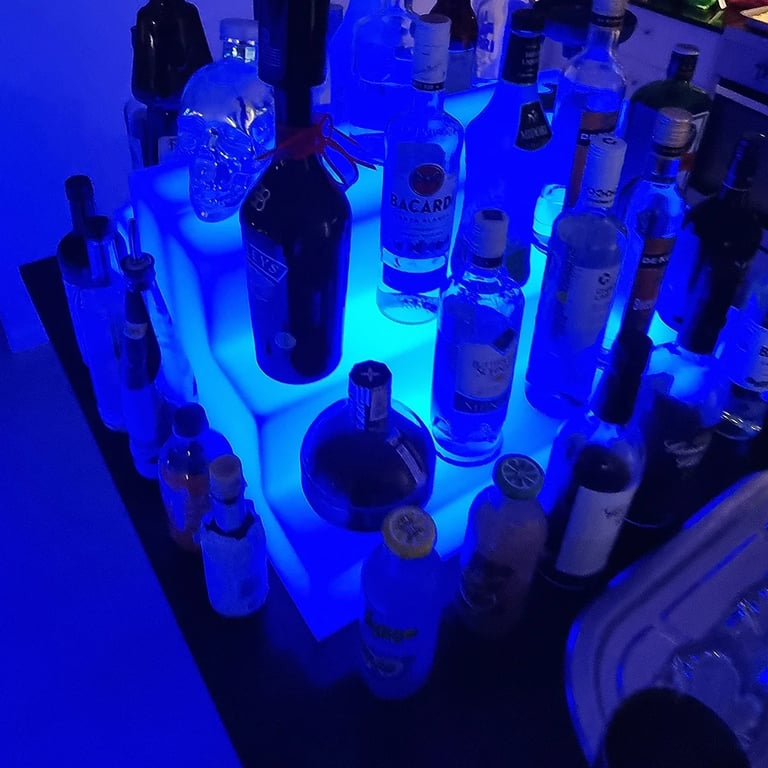Glow Stand lighting up bottles behind the bar at a 21st Party in Redlandbay, Redlands - party hire by SweetAz Co.