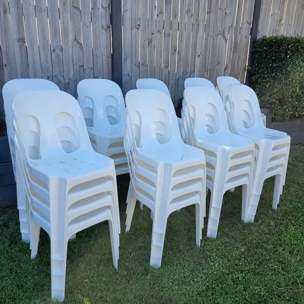 Chairs ready for pickup on the grass after Gillian's wedding at her home in Mount Cotton.