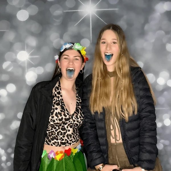 Guests at Brianna's 18th birthday sporting their slushie blue tongues in the photo booth in Redland Bay.