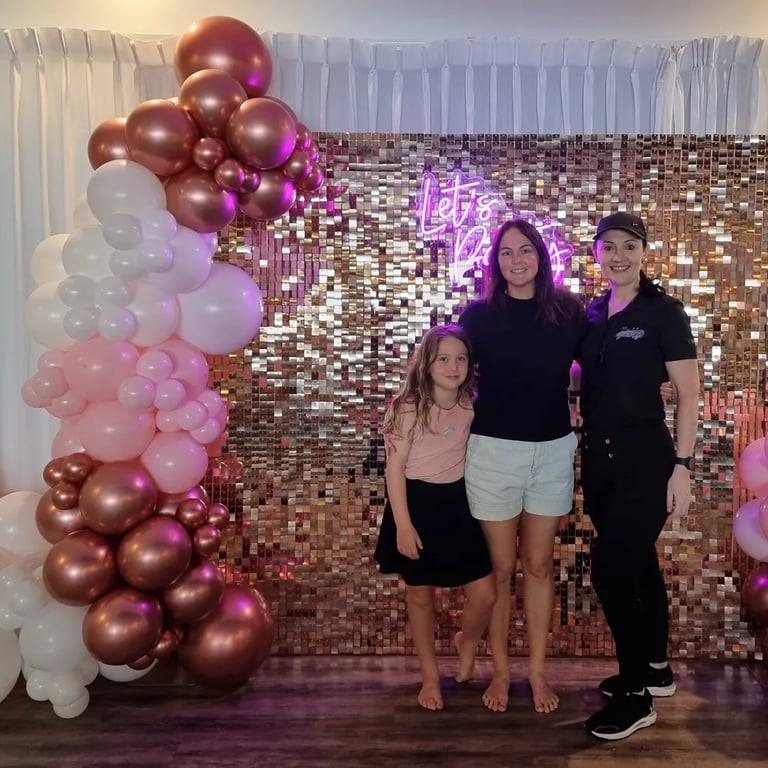 Shimmer Wall moment with birthday girl at a Birthday Party in Cleveland, Redlands - party hire by SweetAz Co.