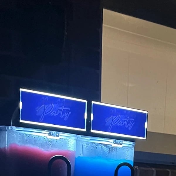 Talyssa's birthday with the slushie machine, glowing into the night in Alexandra Hills.