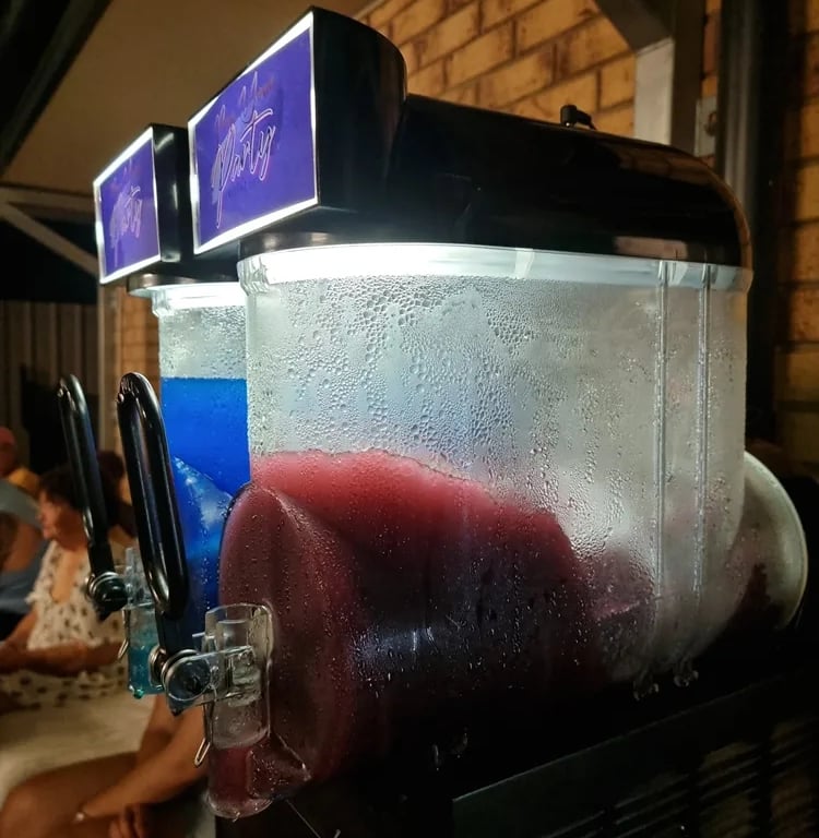 Slushie Machineadding the cool at a 60th Birthday in Wynnum, Brisbane - party hire by SweetAz Co.
