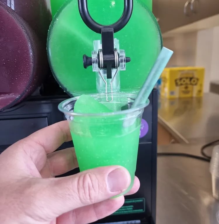 Slushie Machine icy magic in a cup during a Xmas Party in Portofbrisbane, Brisbane - party hire by SweetAz Co.