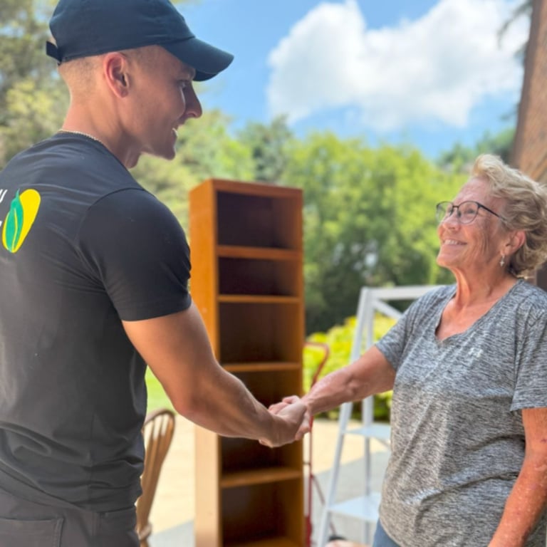 Critical Cleanout owner shaking hands with a Metro Detroit client during an estate clean-out service.