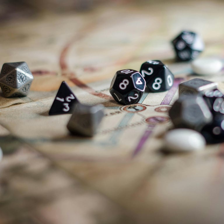 Close up of D20 dice sitting on top of a map from a tabletop game